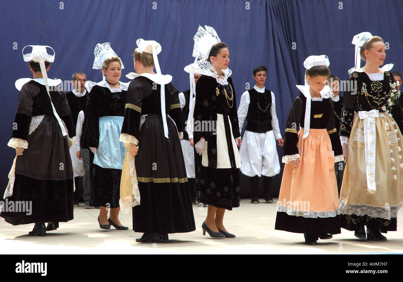Wearing traditional costumes Bretons perform a folk dance during a summer  festival in a Breton village Stock Photo - Alamy