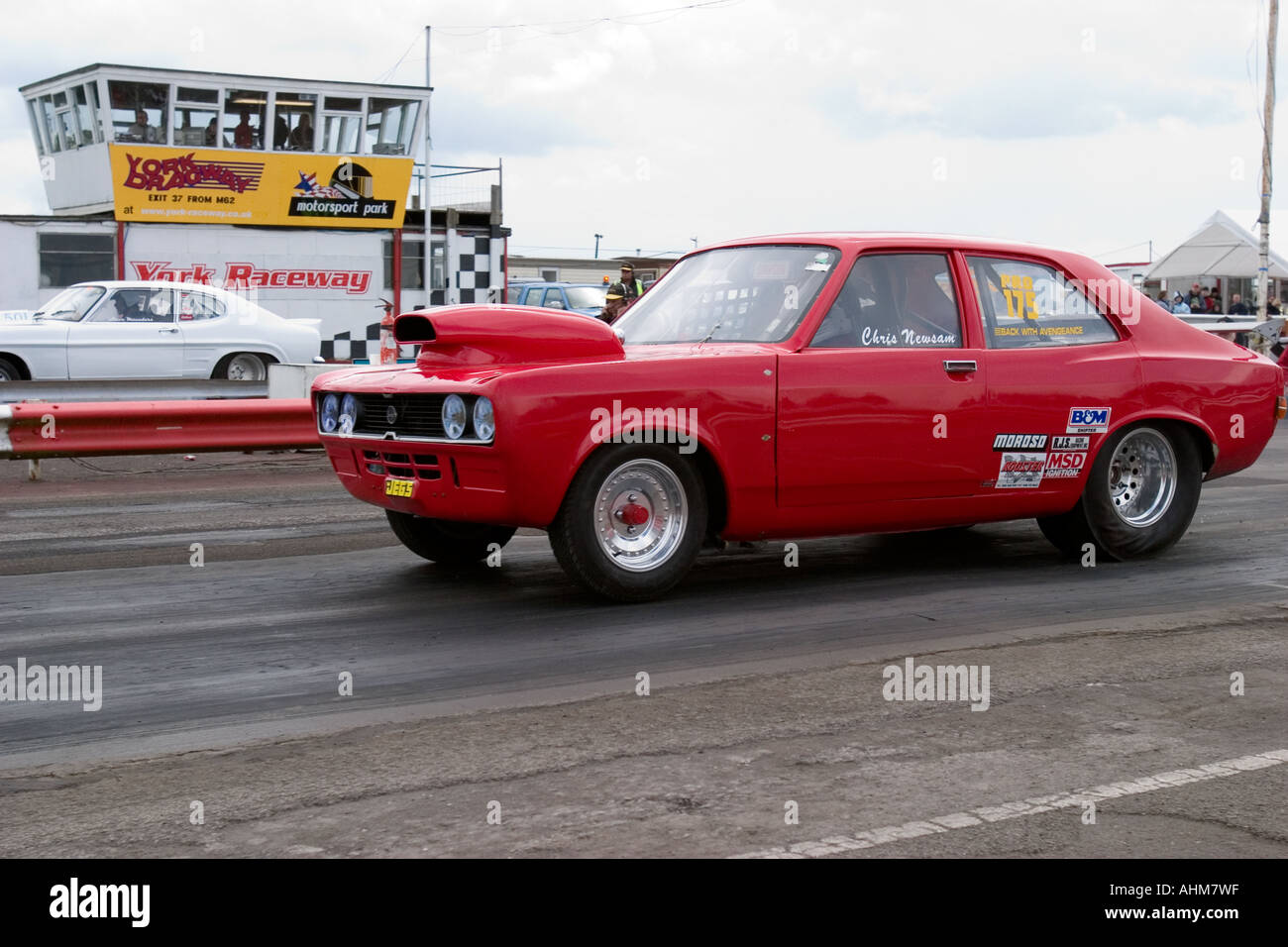 Heavily modified Hillman Avenger leaving start line at drag race Stock ...