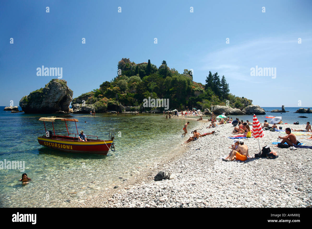 People on the beach at Isola Bella island Taormina Sicliy Stock Photo