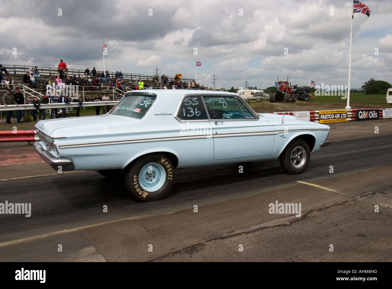 Heavily modified American muscle car on start line at drag race Stock Photo