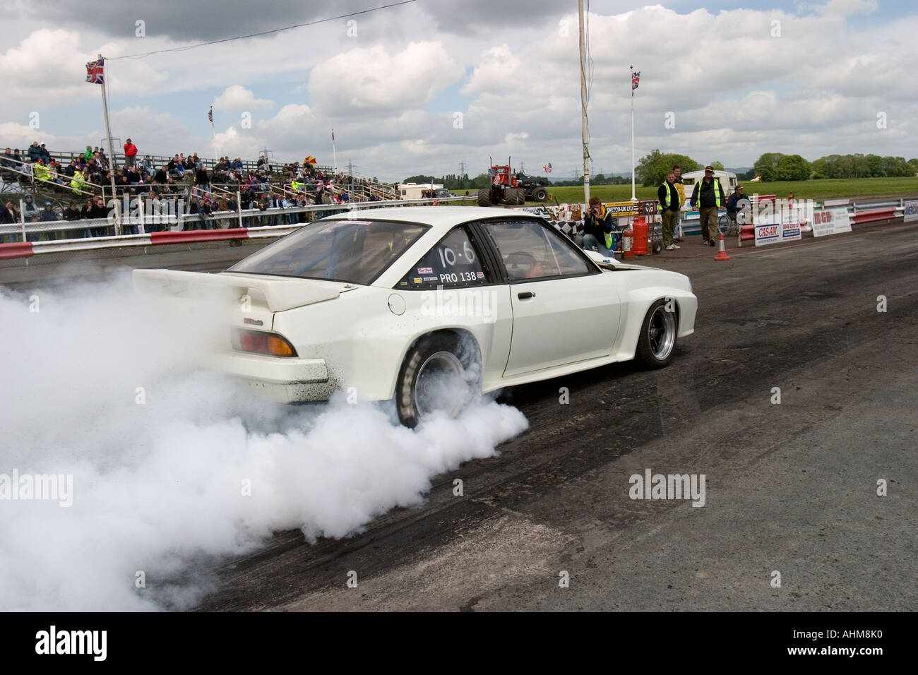 Heavily modified Opel doing a burnout at drag race Stock Photo - Alamy