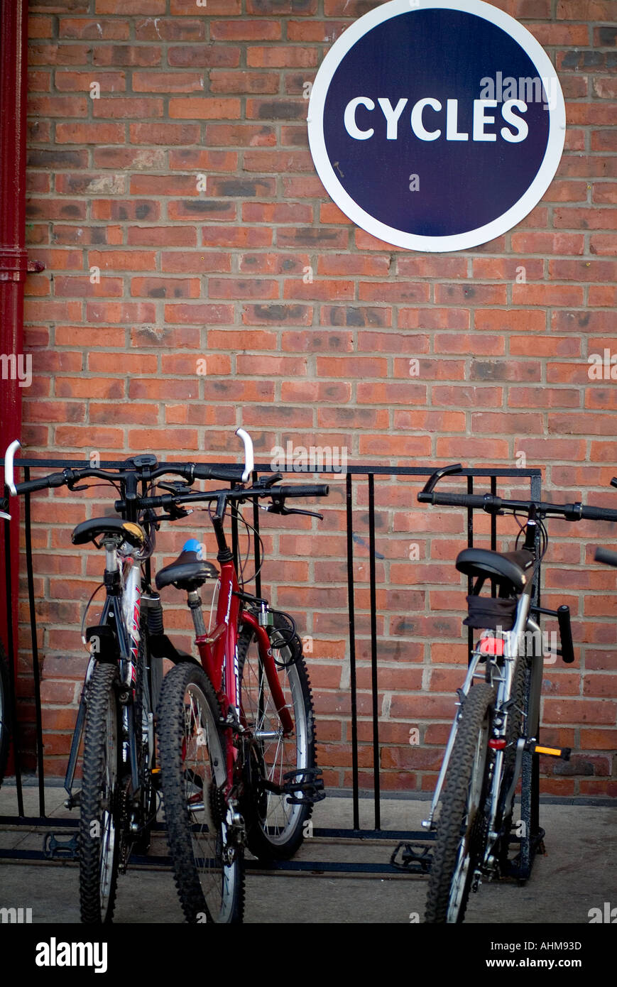 bike rack cycle park green transport zero 0 emmission vechical pollution local journey mountain bike travel lock Stock Photo