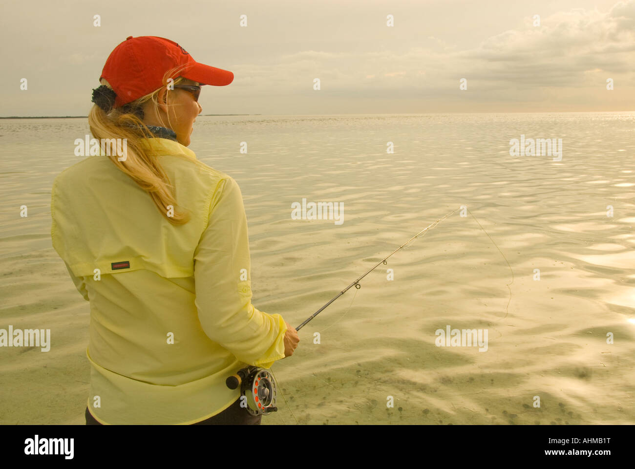 Florida Keys Woman fisherman fly fishing in the flats of the Caribbean