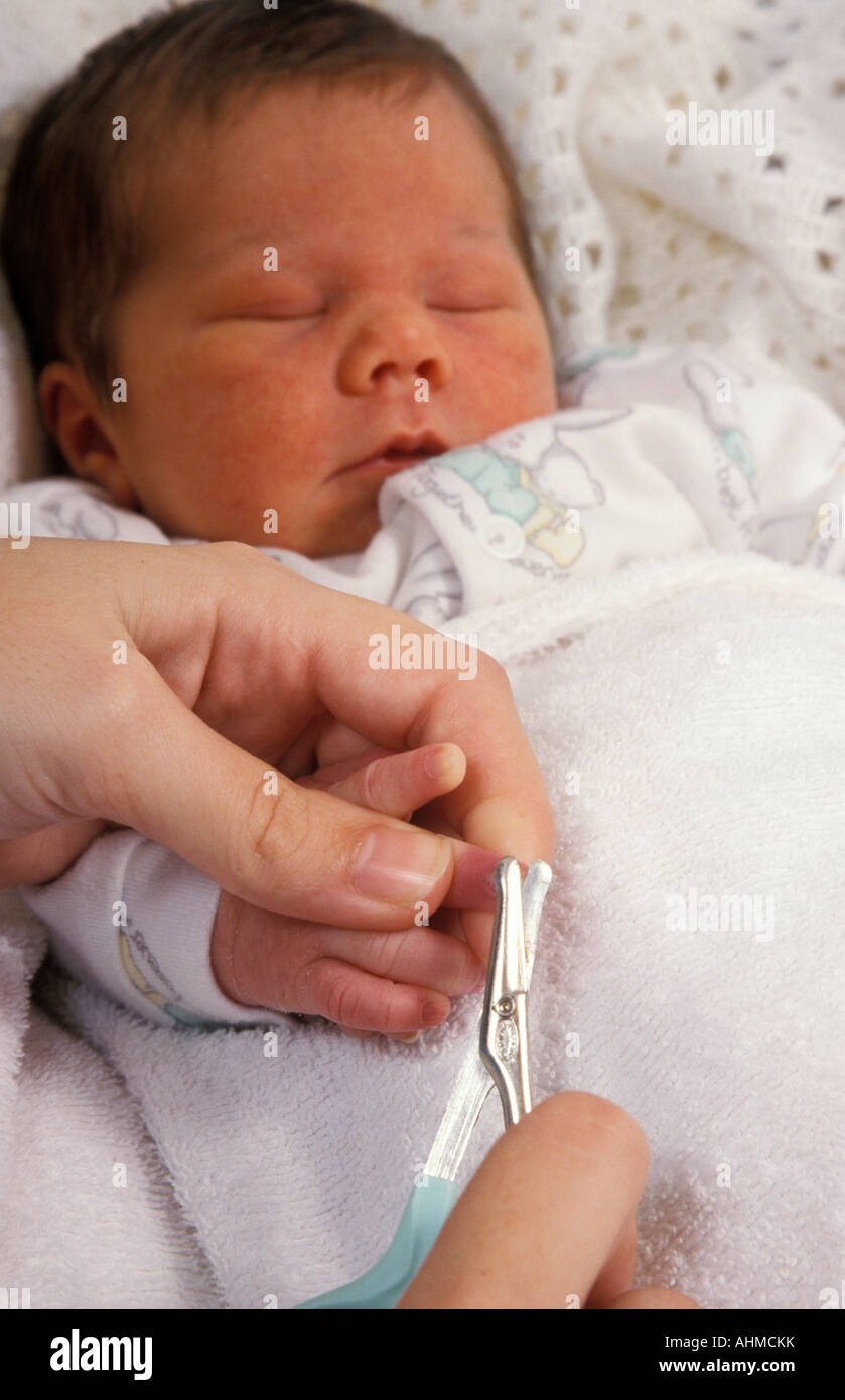 newborn baby having its nails cut Stock Photo Alamy