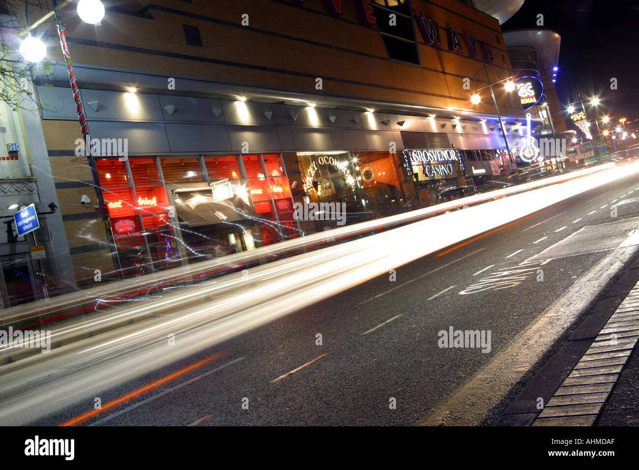 Traffic on a busy street showing traffic trails from the car lights at night Location is Broad