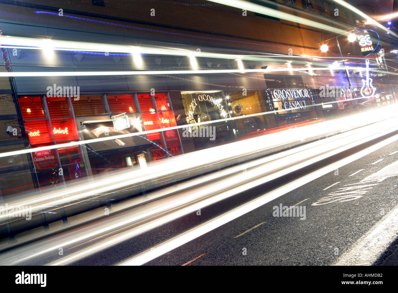 Traffic on a busy street showing traffic trails from the car lights at night Location is Broad