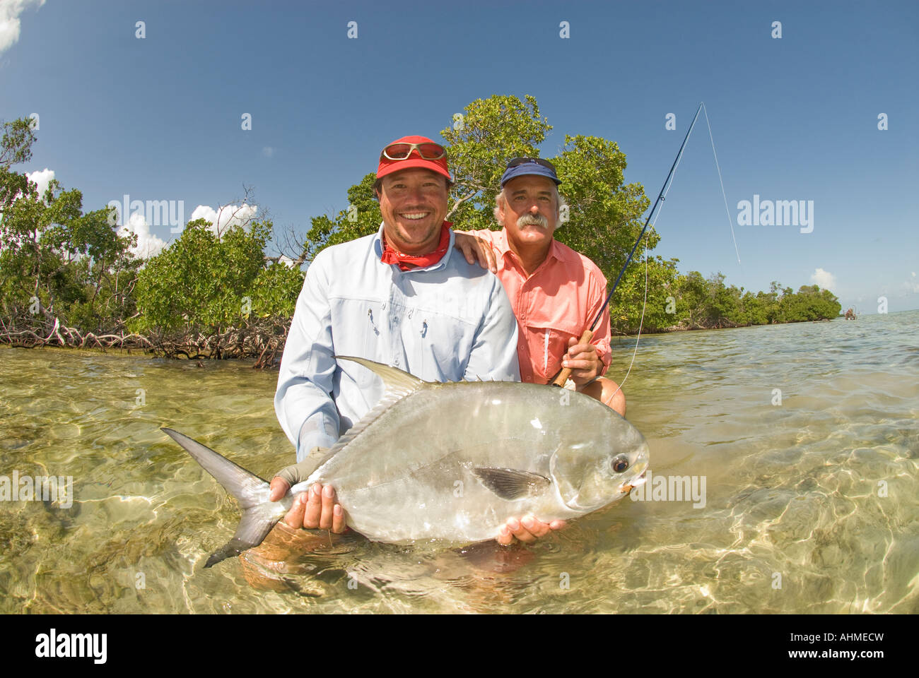 Florida Keys Happ fishermen releasing a large Permit Fish caught while