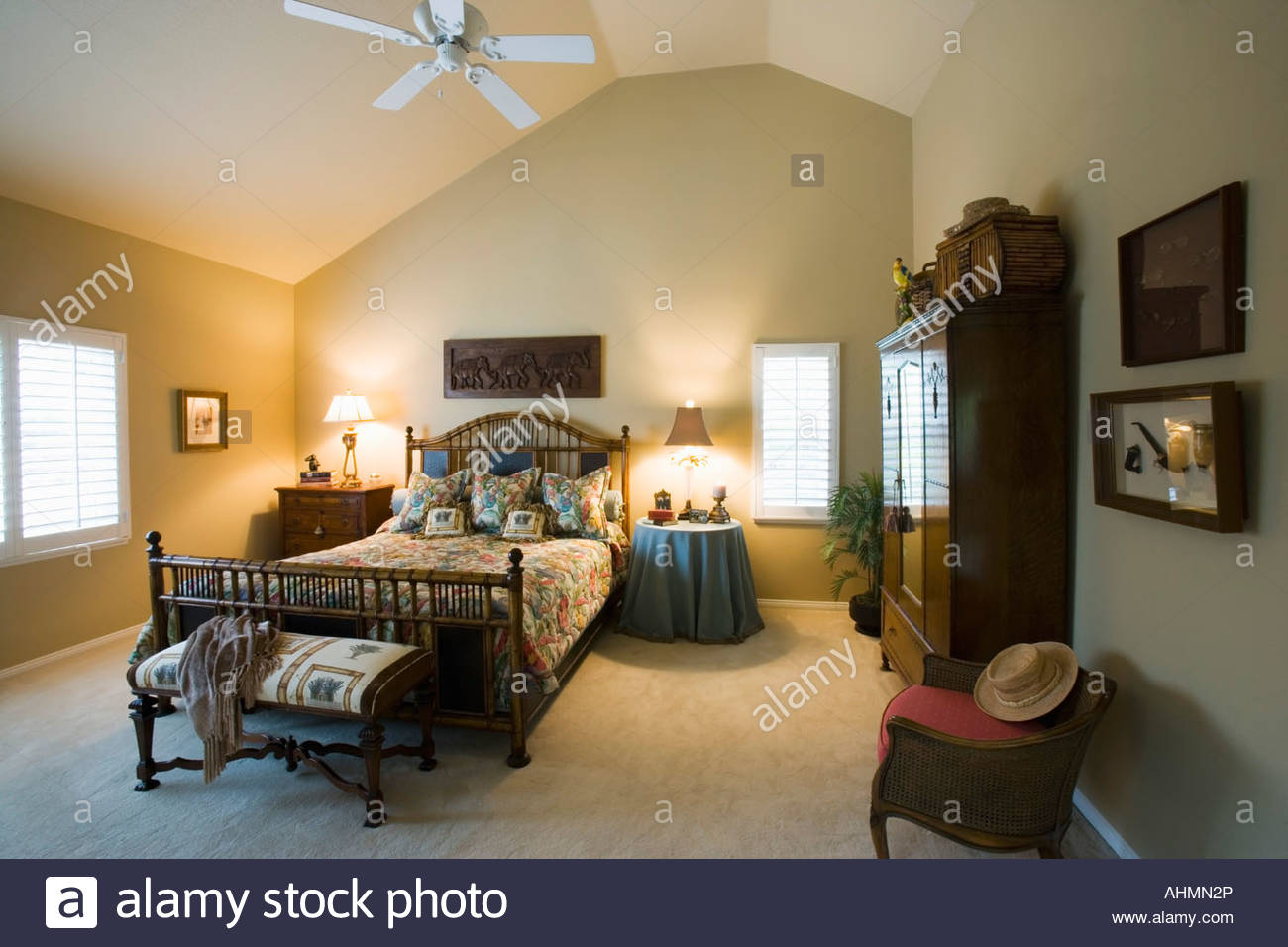 Beach Style Guest Bedroom With Vaulted Ceilings Stock Photo