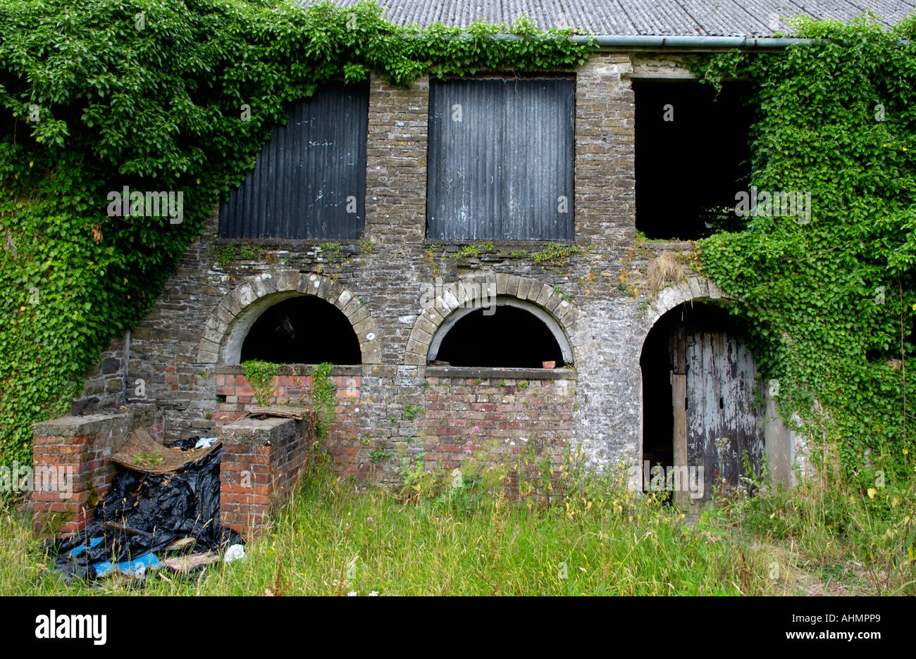 Derelict farm on banks of River Towy at Llandeilo Carmarthenshire Wales