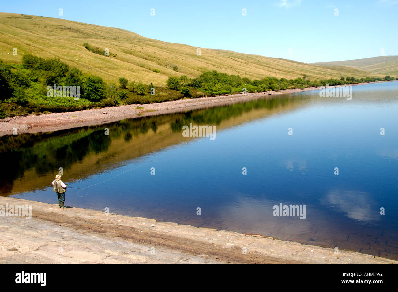 Fly fishing for trout at Ystradfellte Reservoir in the Brecon Beacons National Park Powys South Wales UK GB EU Stock Photo