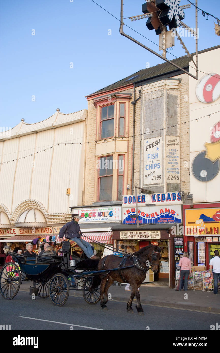 "Horse drawn carriage" on "Blackpool Promenade" carrying visitors past