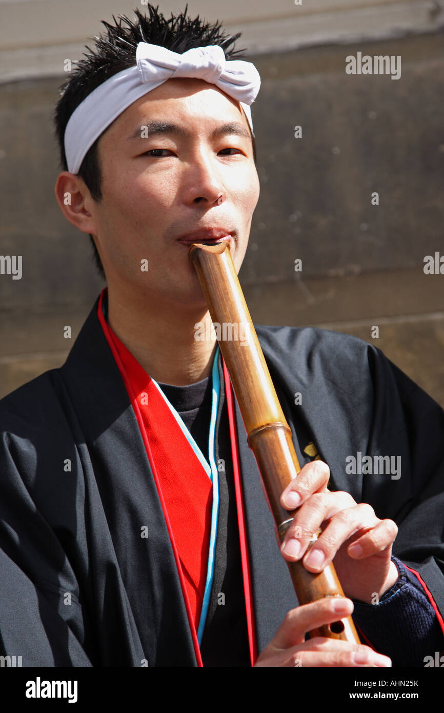 Japanese flute player at Edinburgh Fringe festival Scotland Stock Photo