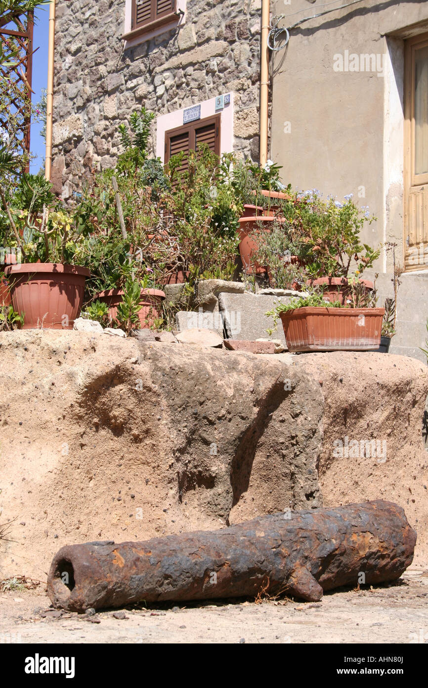 Old canon in courtyard of house next to Forte Su Pisu at St Antioco Sardinia Italy Stock Photo