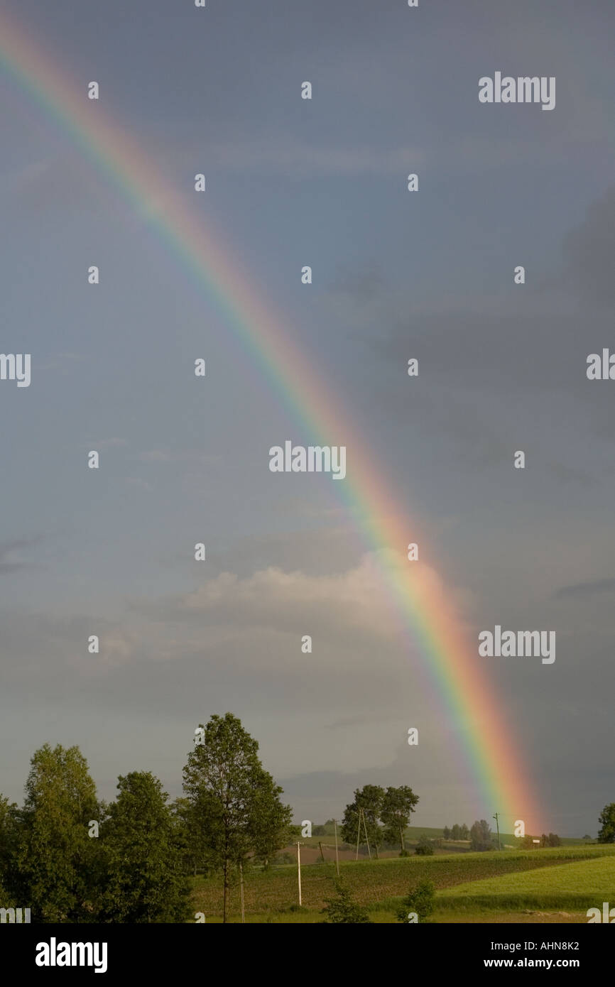 rainbow shining after summer thunderstorm over fields Stock Photo - Alamy
