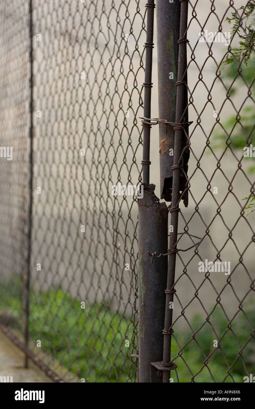 Metal fence with break post Stock Photo Alamy