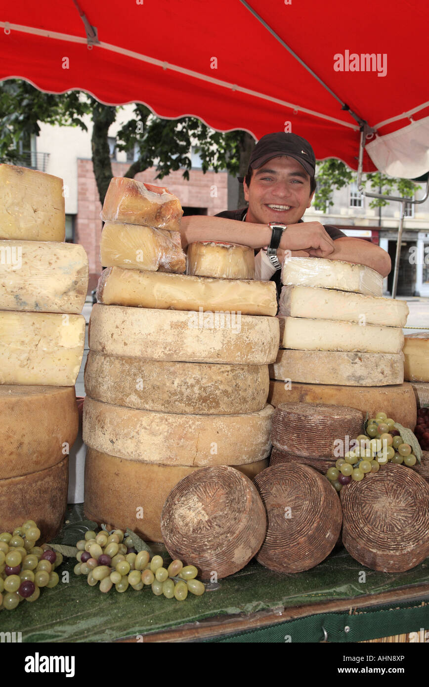 Man selling selection of Italian cheeses from Market stall in Grassmarket Edinburgh Scotland Stock Photo