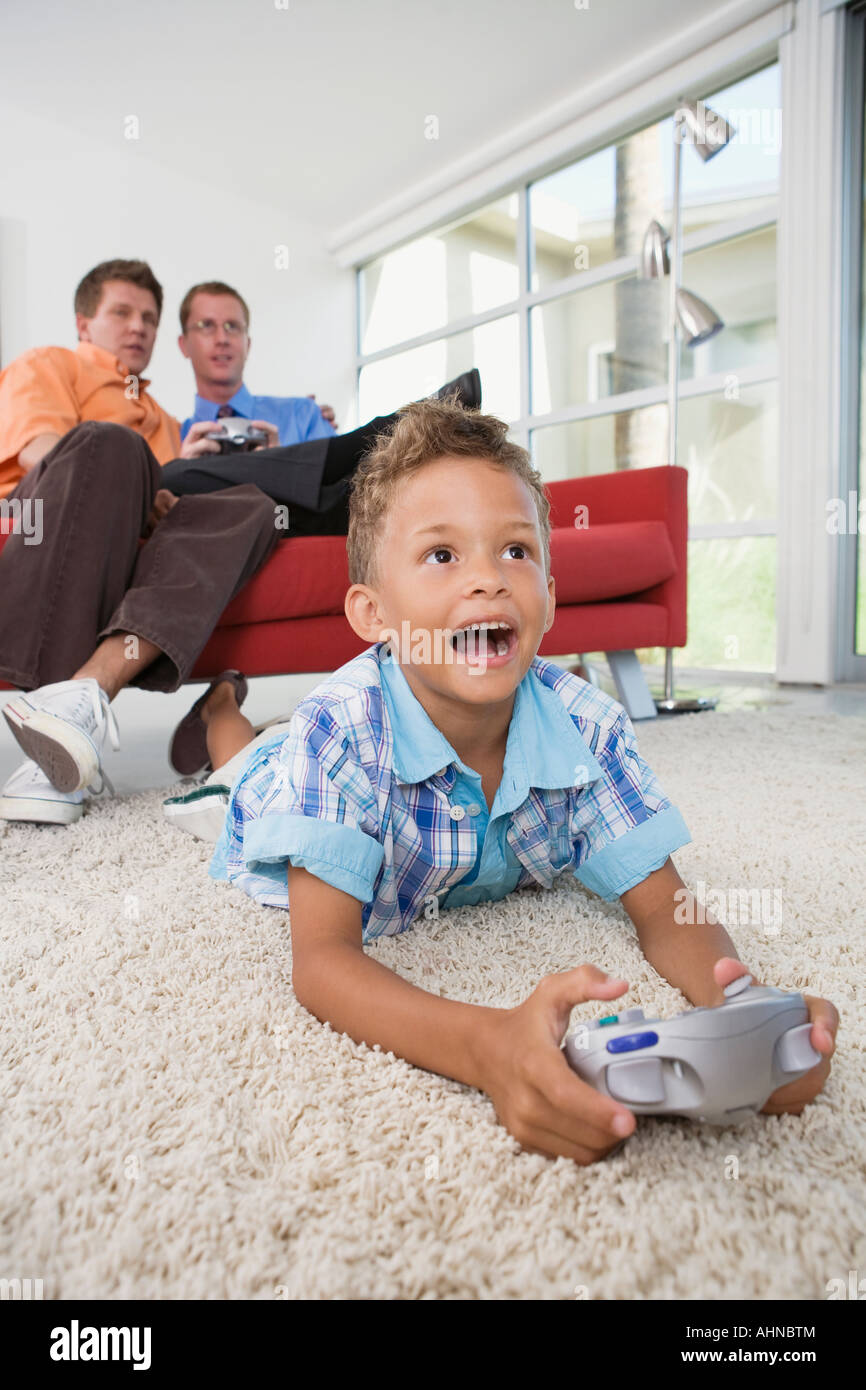 Father and son playing video games Stock Photo