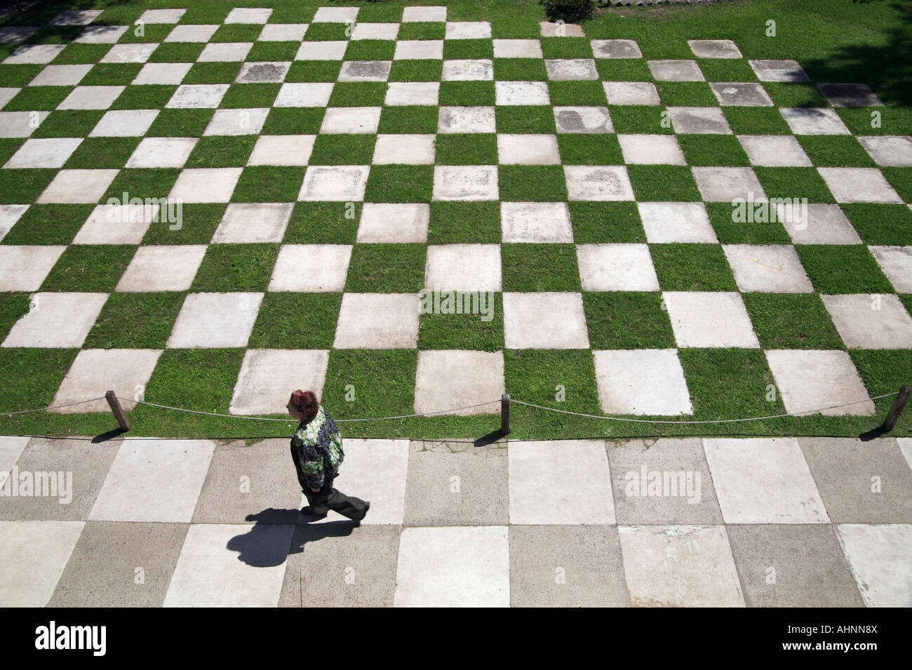 close view of Japanesse garden chess floor park, with old woman walking. Palermo, Buenos Aires, Argentina Stock Photo