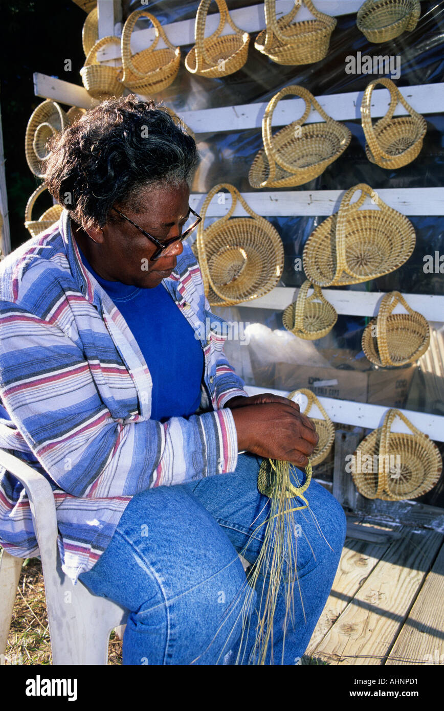 African american woman making sweet grass baskets in Charleston South Carolina  Stock Photo
