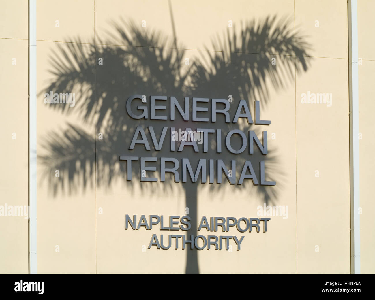 Naples FL airport terminal sign Palm trees Florida Airport Authority