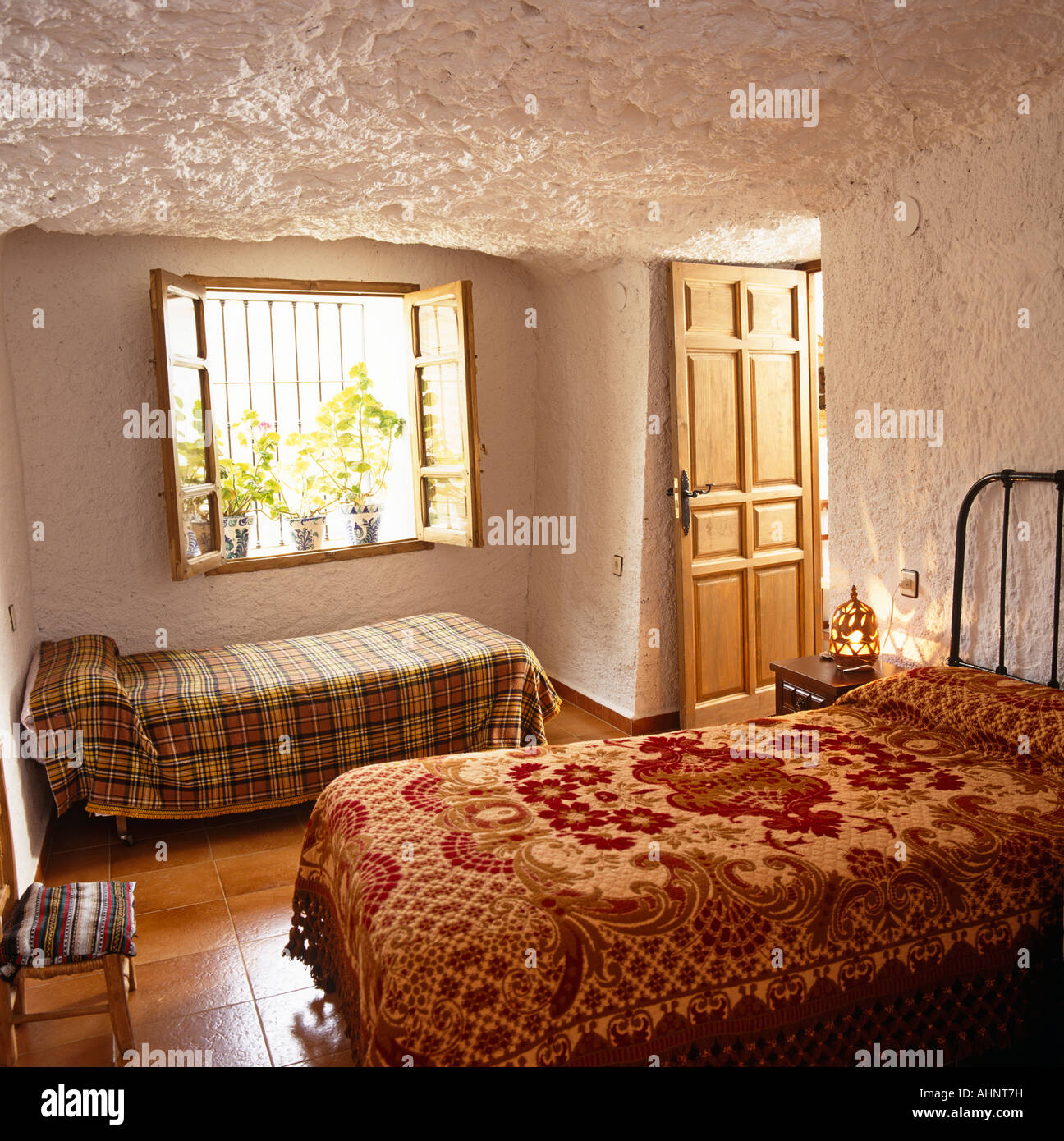 Bedroom of cave self-catering accommodation, Andalucia, Spain Stock Photo