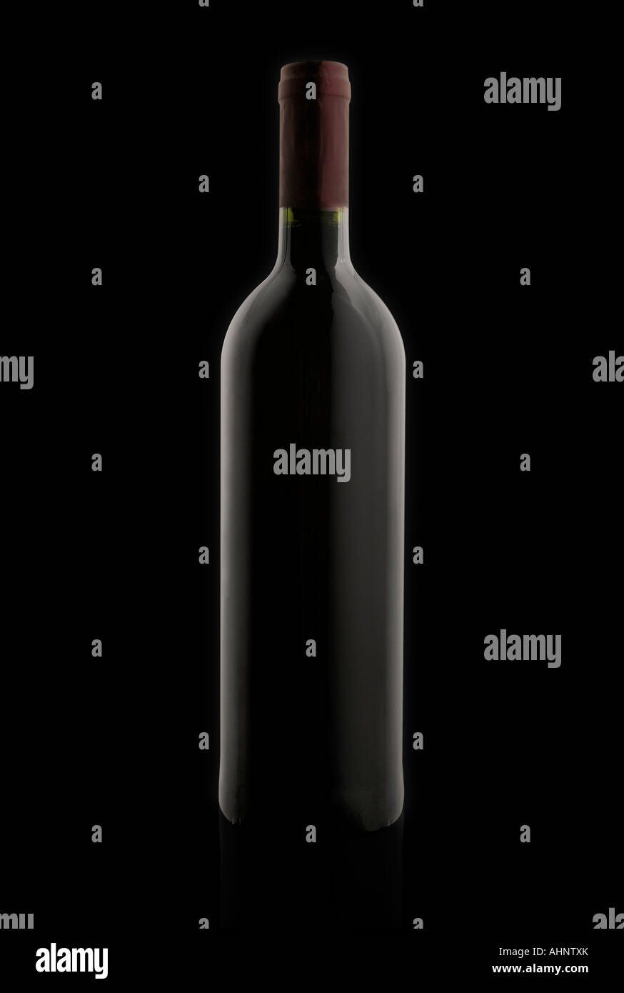 Red Wine Bottle On Black Background In Studio Stock Photo - Alamy