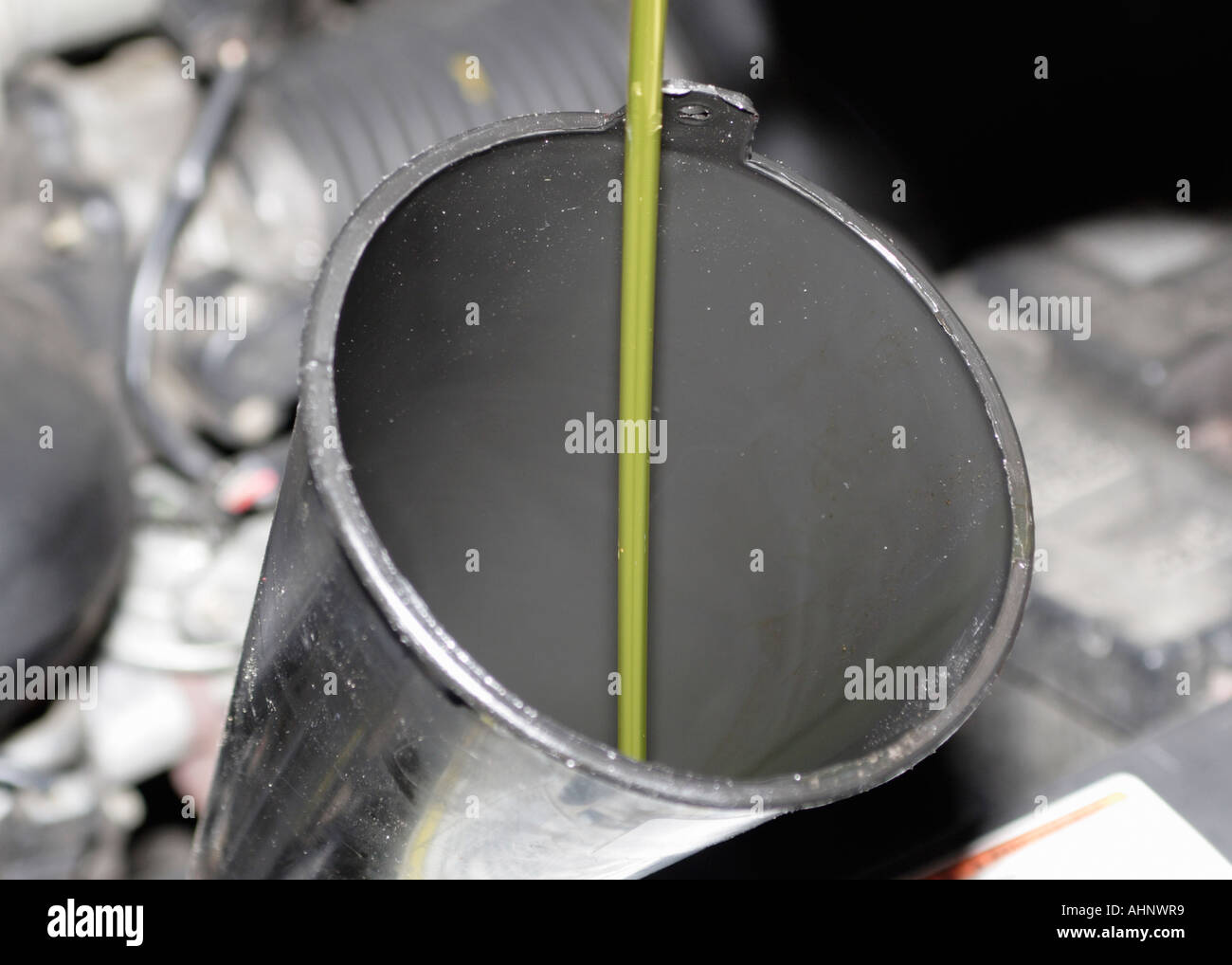 Oil being poured into funnel oil change Stock Photo Alamy