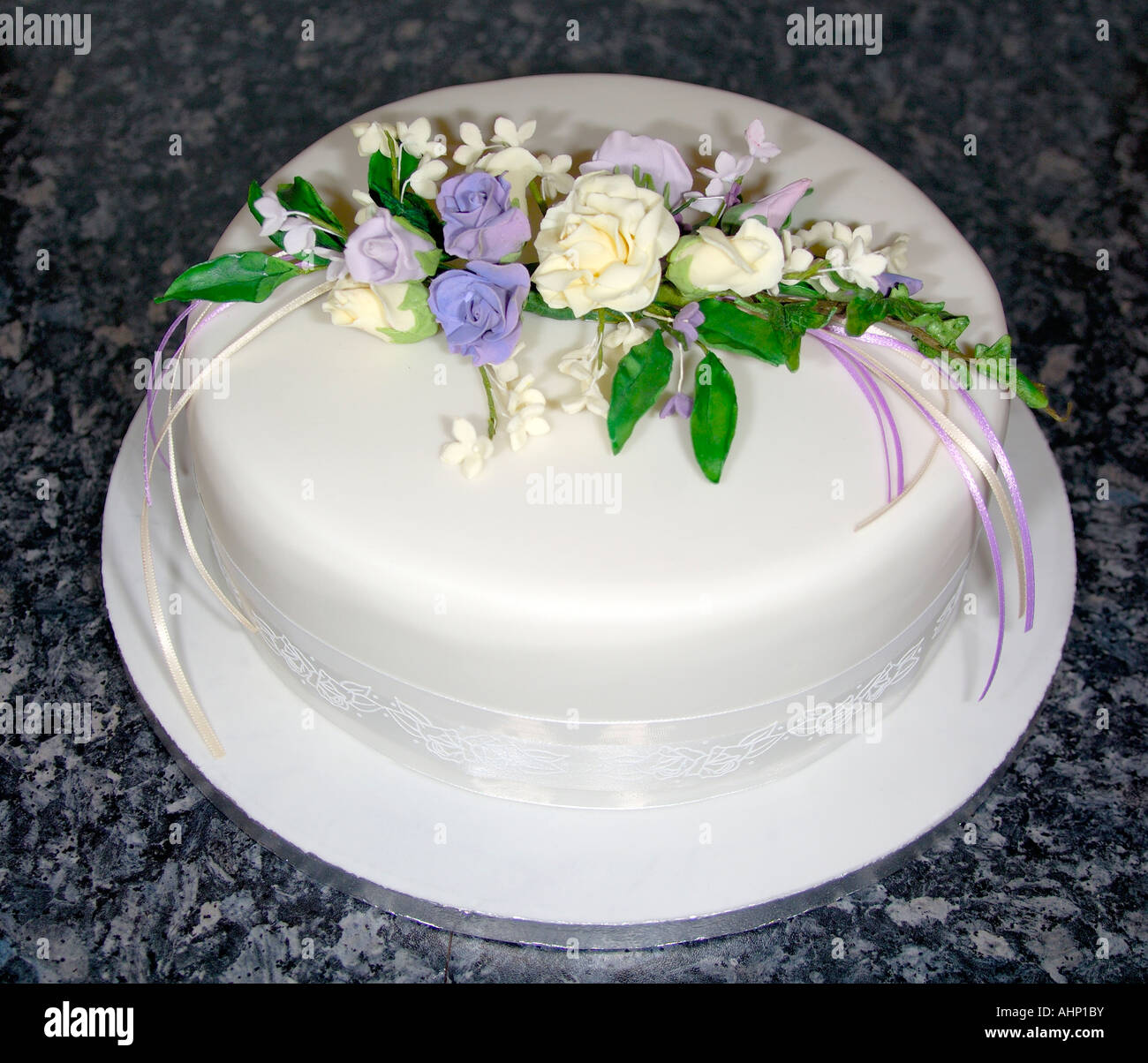 A beautifully crafted hand decorated iced fruit cake in a studio with flash design by Pam Hannon Stock Photo