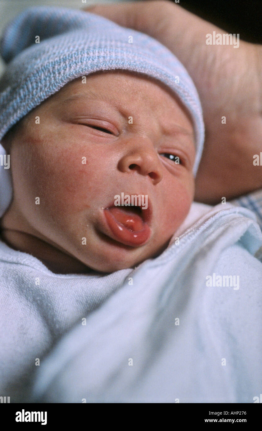 Newborn baby boy with his mouth open Stock Photo Alamy