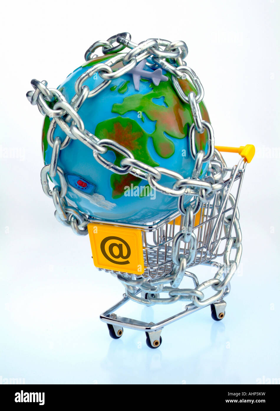 An empty shopping cart with @ on it and a globe chained to it Stock Photo