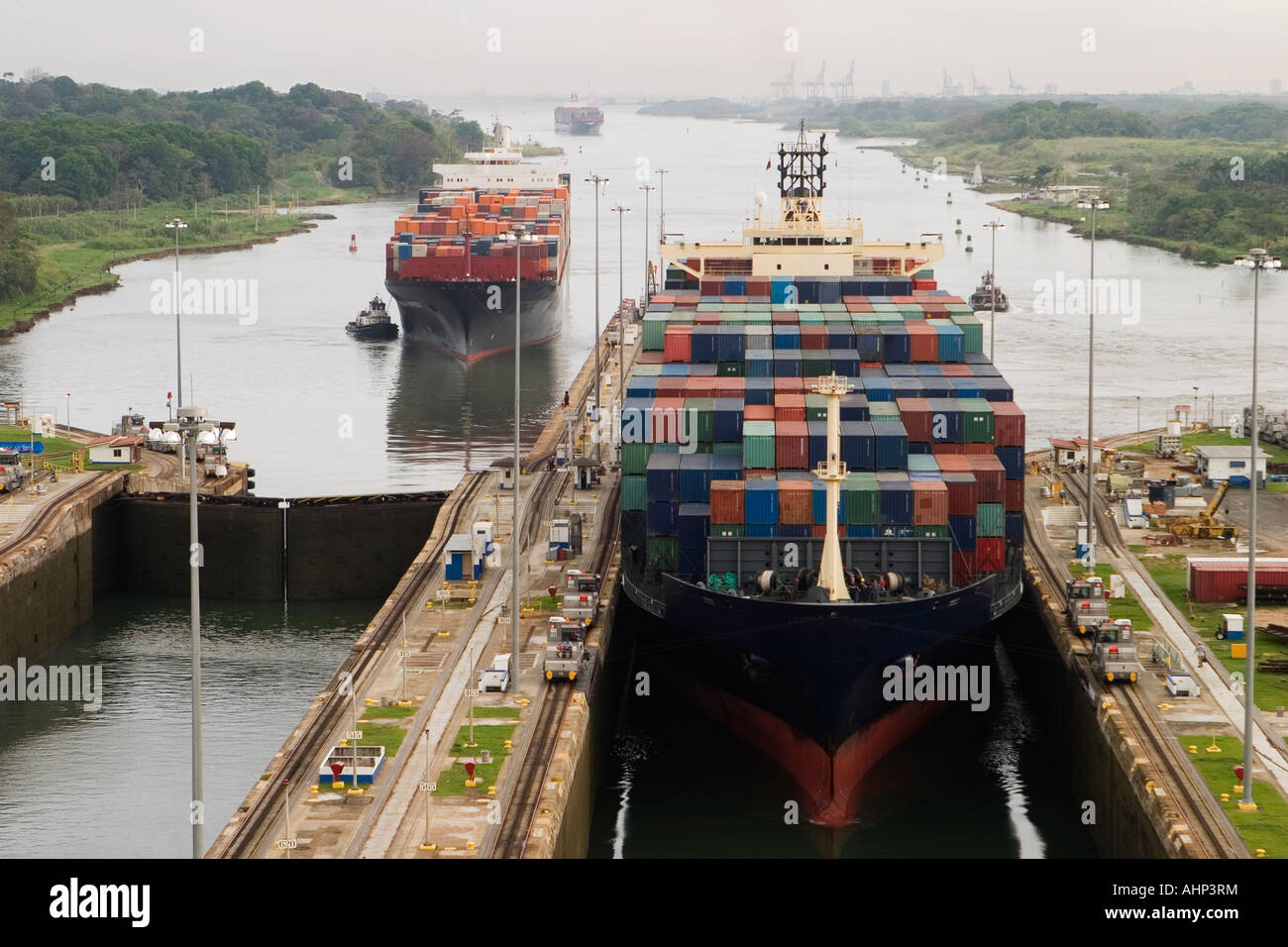 Several container ships passing through the Panama Canal Stock Photo