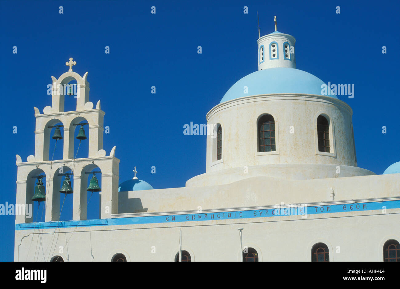 Pale blue dome and six bells on church roof Oia Santorini Greece EU Europe Stock Photo