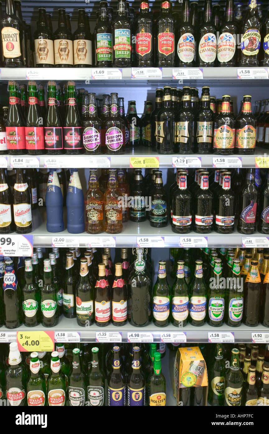 Bottled beers on supermarket shelves Stock Photo