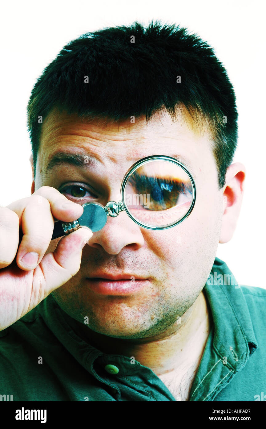 Man with Magnifying glass looking Stock Photo