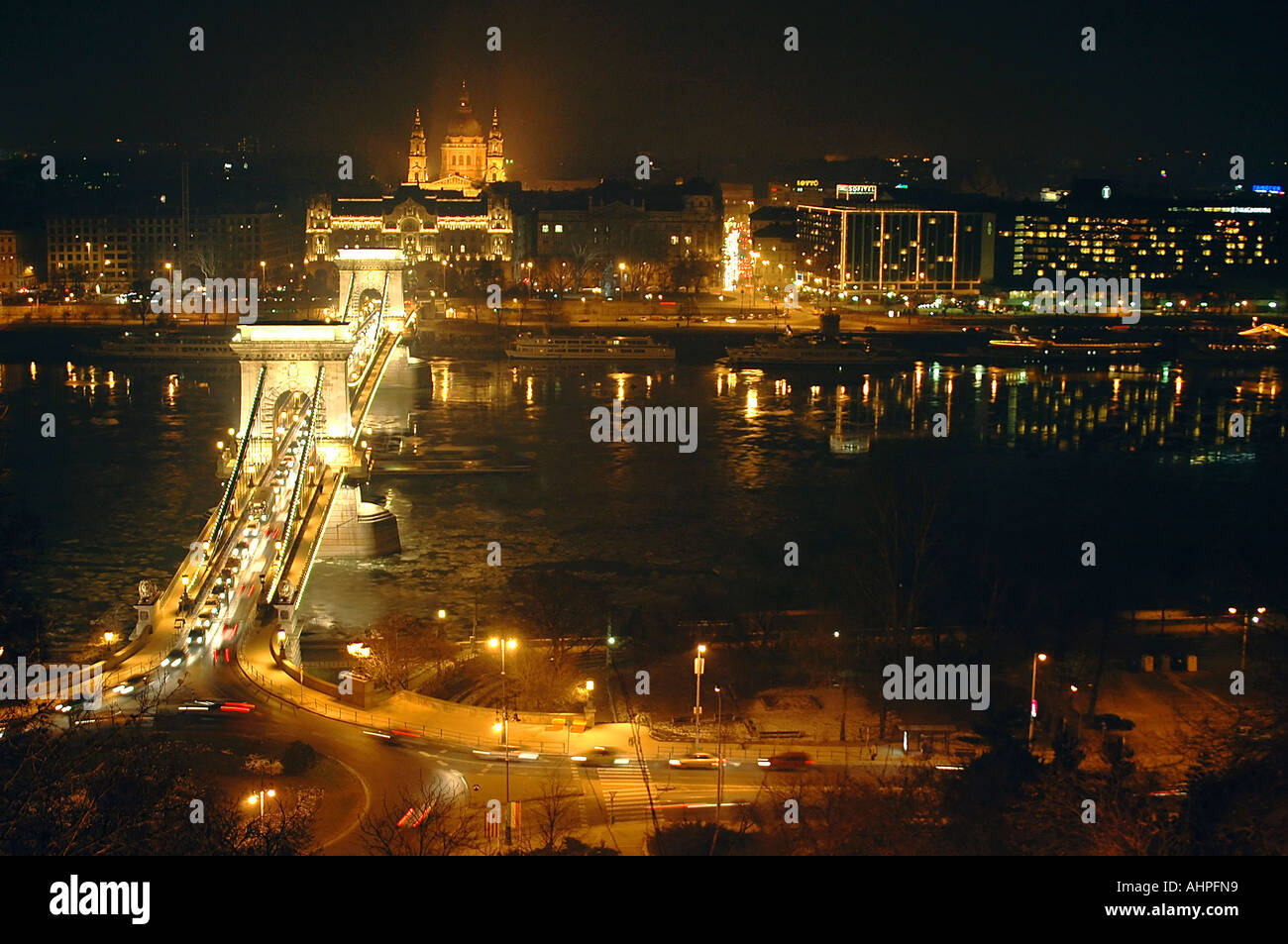 Horizontal wide angle aerial view of the River Danube and the Chain Bridge lit up at night. Stock Photo
