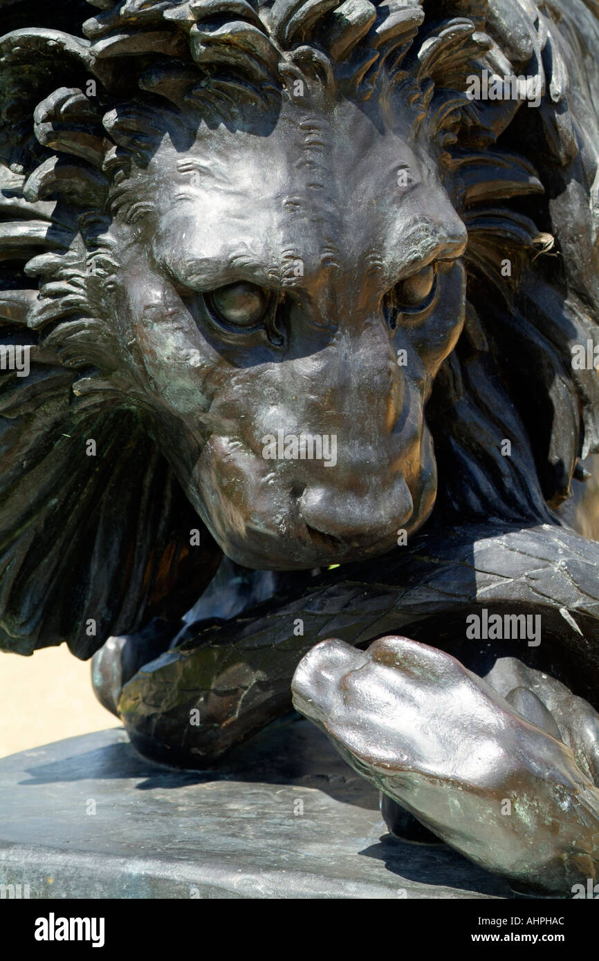 A bronze Lion killing a snake statue Stock Photo 4741547 Alamy