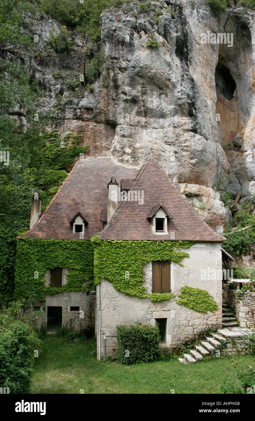 House under a cliff, Vers, France Stock Photo