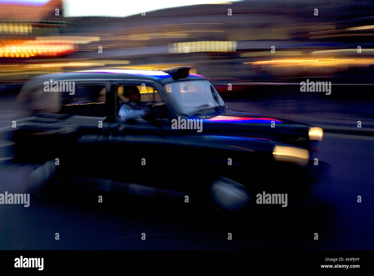 London Black Cab Blurred Motion Stock Photo