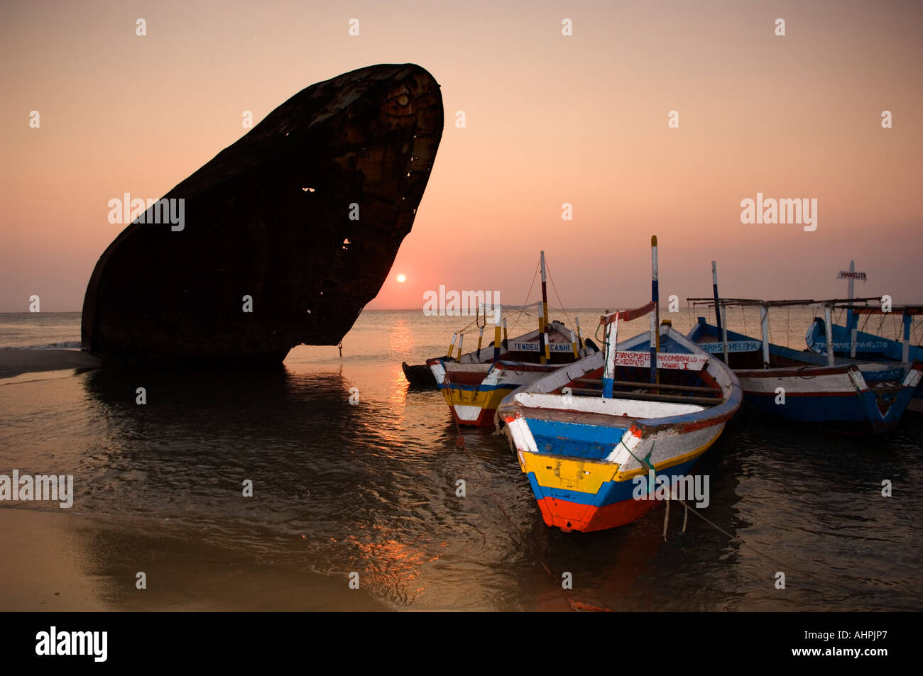 fishing boats lie along old ship wrecks, Beira, Mozambique Stock Photo