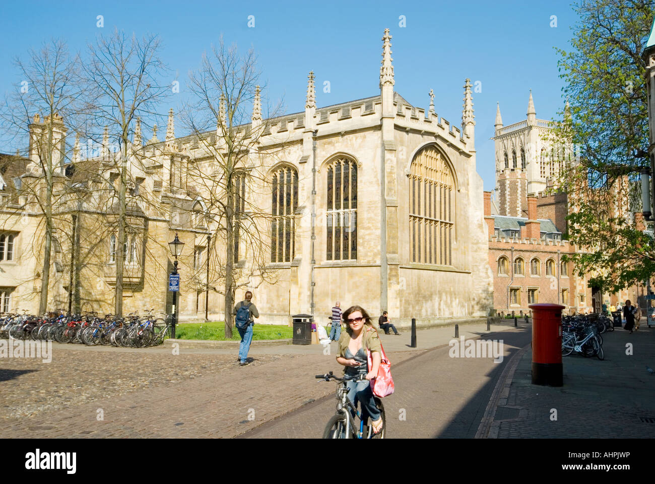 Woman cycling by St. John's College, Cambridge Stock Photo