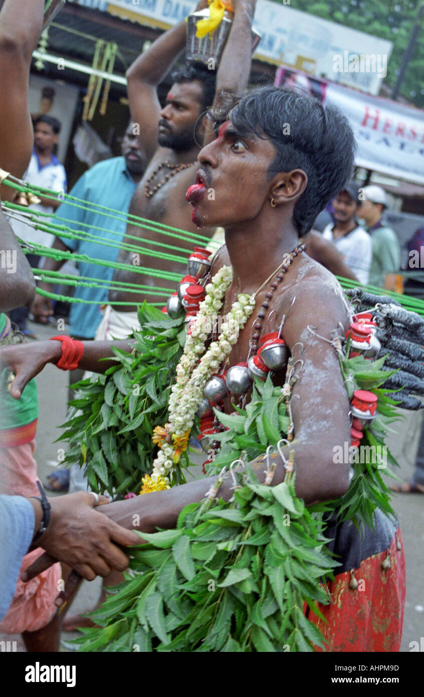 Thaipusam devotee in a trance walking towards Batu Caves Kuala Lumpur