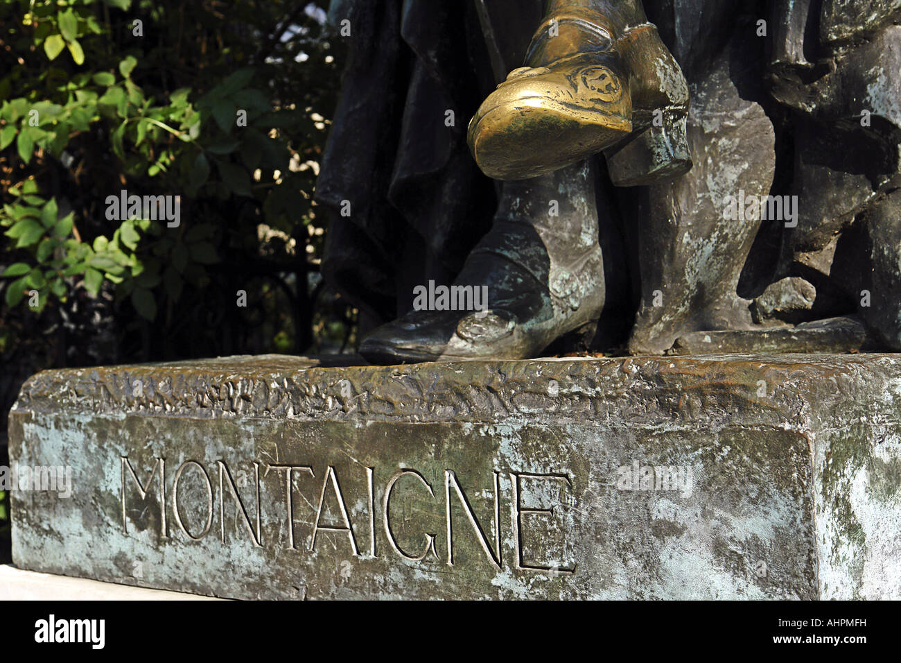 Golden foot of the statue of Montaigne in front of the Sorbonne in