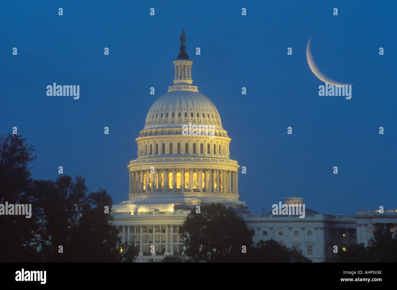 Crescent moon over U S Capitol Building dome Stock Photo