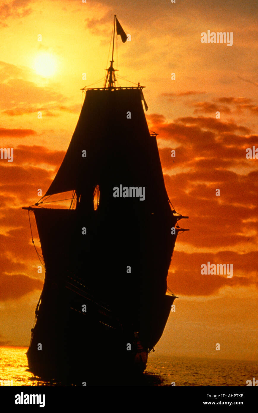 A ship sailing at sunrise as a Mayflower historic recreation Search For a New World Stock Photo