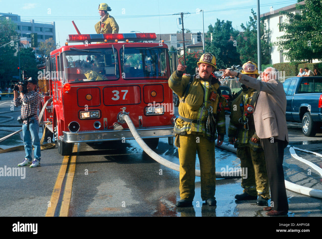 Firefighters with a witness at condominium in Brentwood California Stock Photo