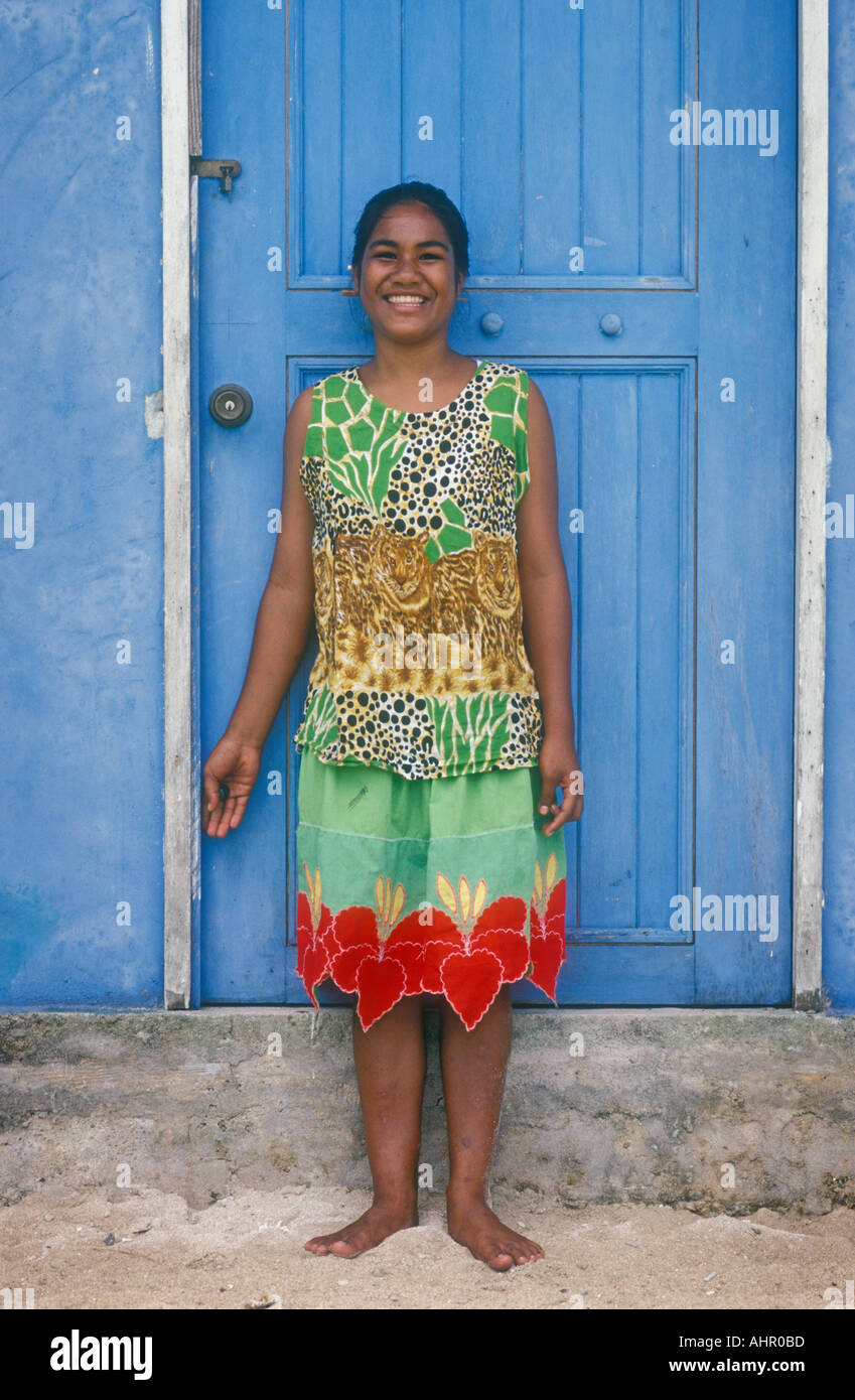 Kosrae Micronesia young woman MaryAnn Taulung against blue door in village of Walung  Stock Photo