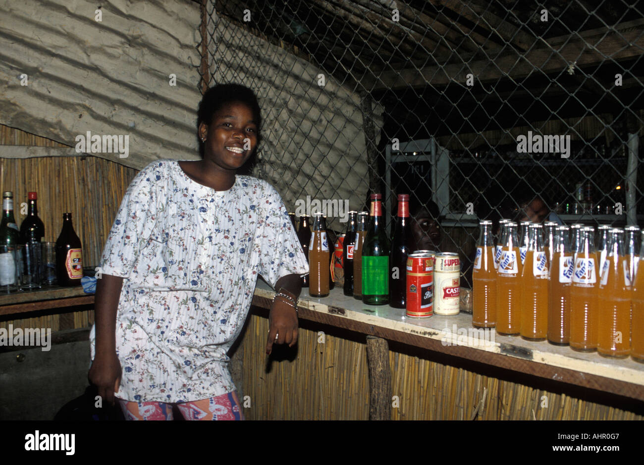 woman enjoying a night out at a small bar in Barracas de Museu, Maputo,  Mozambique Stock Photo - Alamy