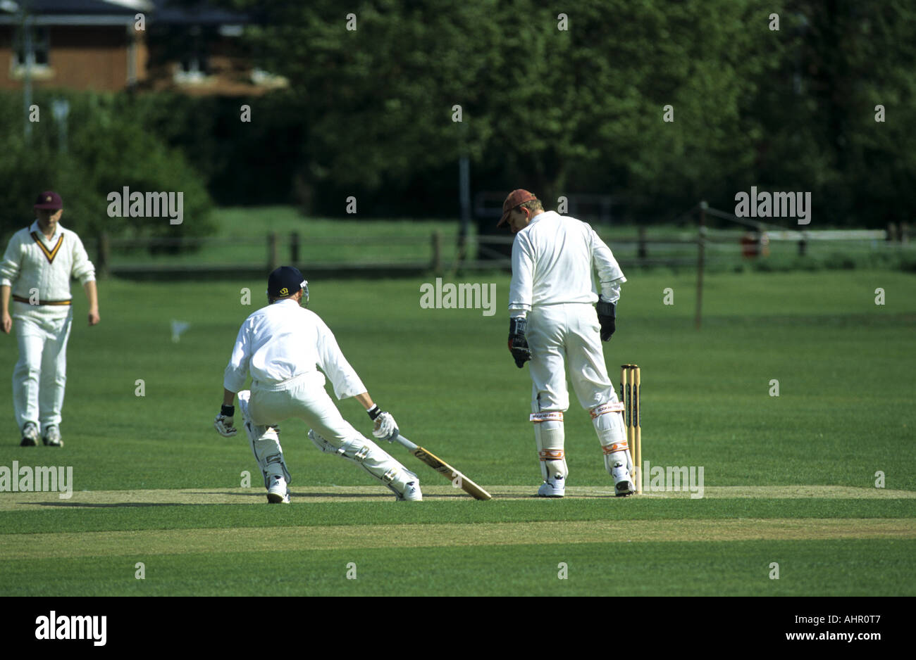 Batsman touching crease during village cricket match at Wellesbourne
