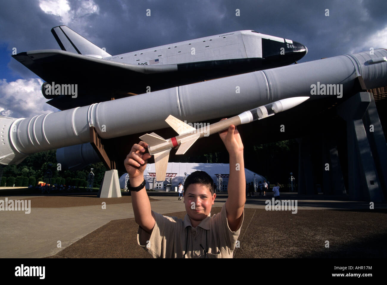 Huntsville AL Space Camp 13 yr old Guillaume Couture w his rocket in front of scale model of Space Shuttle Stock Photo