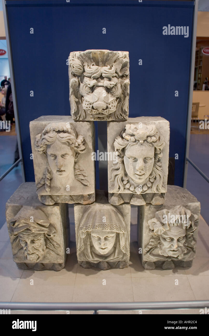 Heads carved in stone from old Greenwich buildings on display in the Information Centre Greenwich London UNESCO World Heritage Stock Photo